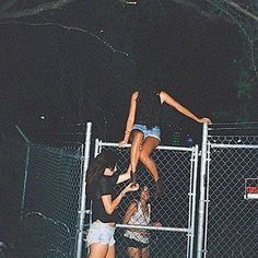 two girls are hanging upside down on a fence with the caption we are the recklesses we are the wild youth