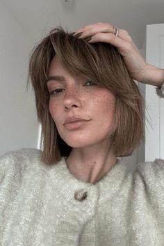 This short bob haircut stops just past the shoulders, giving a new, young feeling with its messy layers. The bangs are fixed in a relaxed, choppy way that beautifully shows off the face, lending a fun and current twist. Textured ends make it seem fuller and livelier, letting this style fit different face forms and hair sorts well. - Click to see more of 27 Stunning Choppy Bob Haircuts to Inspire Your Next Look and follow us for more hairstyle ideas. // Photo Credit: Instagram @vivabenard How To Style A Choppy Bob Tutorial, Messy Bob With Wispy Bangs, Choppy Bob Back View, Choppy Parted Bangs, How To Fix Choppy Layers, Uneven Bob, Messy Layers, Short Textured Bob, Inspiring Hairstyles