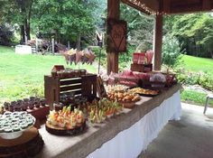 a table covered with lots of food and desserts