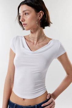 Elevated essential Silence + Noise cowl neck top in a soft and stretchy bodycon fit that's cropped above the waist. Better-than-basic tee, it's perfect on it's own or layered. Find it only at Urban Outfitters. Features Silence + Noise Lara cowl neck top Fitted cropped top Elevated essential in a range of fave colors Soft and stretchy knit Cowl neckline Cap sleeves Cropped length UO exclusive Content + Care 95% Viscose, 5% spandex Machine wash Imported Size + Fit Model in Black is 5’11" and weari Trendy Cowl Neck Top For Spring, Versatile Fitted Cowl Neck Top, Stretch Solid Color Cowl Neck Top, White Outfit, Cowl Neck Top, Knit Cowl, Jeans For Sale, Black Fits, Cropped Top