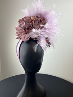 Mauve dahlias and hydrangeas piled high and accented with a lilac feather crown. Sits on a comfortable lilac headband. Ships in a high quality storage box. One of a kind.  Perfect for Kentucky Derby, Royal Ascot, church, weddings, just for fun. Purple Feather Headpieces For Spring, Purple Feathered Headpieces For Kentucky Derby, Purple Feathered Headpieces, Purple Handmade Flowers Headpiece For Kentucky Derby, Purple Headpiece With Handmade Flowers For Kentucky Derby, Elegant Purple Feathered Headpiece, Purple Handmade Flowers Headband, Purple Headband With Handmade Flowers, Elegant Purple Flower Fascinator