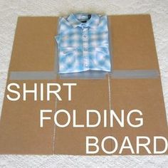 the shirt folding board is laying on top of cardboard