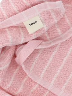 Tekla guest towel in pink cotton terry cloth with striped pattern, white details, front logo label, square-shaped. composition: 100% cottonsize and fit: h 30 x w 30 cm Versace Leather Jacket, Fendi Wallet On Chain, Rick Owens Jacket, New Bottega, Self Portrait Dress, Guest Towel, White Details, Logo Label, Fendi Wallet