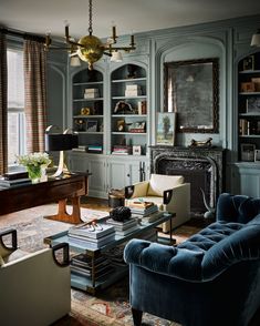 an instagram photo of a living room with blue furniture