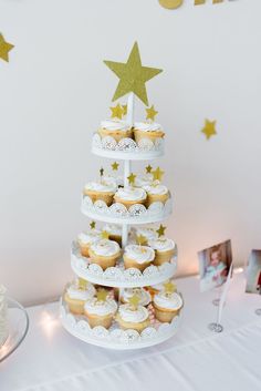 cupcakes are stacked up in the shape of a christmas tree