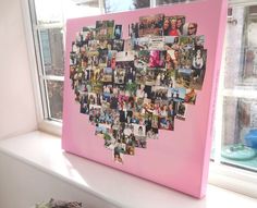 a heart shaped photo collage on a window sill in front of a pink wall