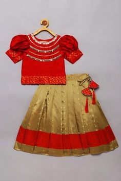 Red and golden pleated pattu lehenga with attached cancan and brocade paneling at hem. Paired with a red blouse with embroidered mirror detail on yoke and pleated brocade at hem. - Aza Fashions Festive Red Lehenga With Ruffles, Fitted Red Lehenga With Ruffles, Red Ruffled Lehenga For Diwali, Bollywood Red Lehenga With Ruffles, Bollywood Style Red Lehenga With Ruffles, Traditional Red Lehenga With Ruffles, Red Ruffled Sets For Diwali, Festive Red Sharara With Ruffles, Red Bollywood Style Ruffled Sets