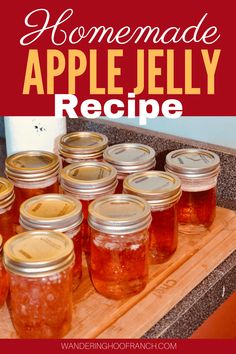 homemade apple jelly recipe in mason jars on a cutting board with text overlay that reads homemade apple jelly recipe