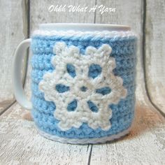 a crocheted coffee cup with a snowflake on it