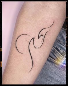 a woman's arm with a small tattoo on the left side of her arm