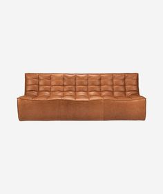 a brown leather couch on a white background