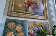 three paintings hanging on the wall with flowers in them