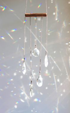 a wind chime with crystal drops hanging from it