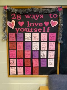 a bulletin board that has been decorated with pink and purple notes on it, along with hearts