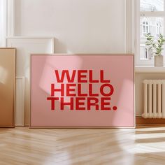 a pink poster with the words well hello there on it in front of a window