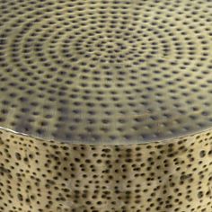 a close up view of a round object with holes in the middle and on it's surface