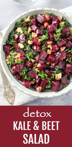 a bowl filled with beets and broccoli on top of a table