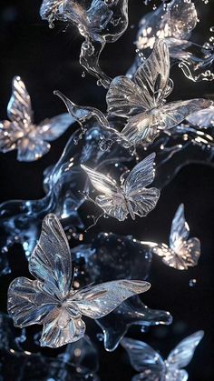 several glass butterflies floating in the air