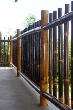 a wooden fence made out of bamboo sticks