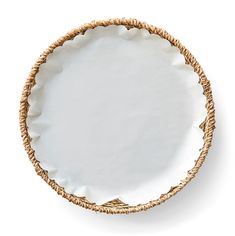 a white plate with gold trim on the rim is shown in front of a white background