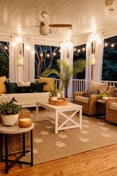 a living room filled with furniture and lots of lights on top of the windowsill