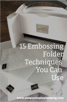 a white box with some tags on it and the words, 15 embossing folder techniques you can use