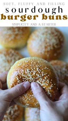 a person holding a bun with sesame seeds on it and text overlay reads soft fluffy and filling burger buns simply and a starter