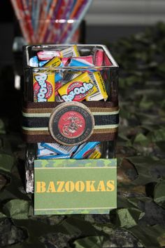 a box filled with assorted candy sitting on top of a table