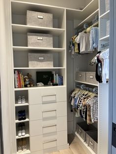 an organized closet with white shelves and drawers