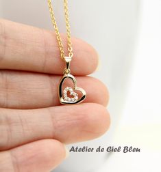 This stunning heart in heart necklace is simple and unique, which is a perfect gift for someone you love and perfect as bridesmaid gift. This cz heart in heart necklace is made of the following: (1) gold plated cubic zirconia heart charm (10.5 x 9 mm excludes connector, thickness: 1 mm) (2) Gold plated or 14KGF necklace chain ✏️ Please choose the exact length of the chain (the length includes clasp and findings). ❣️ If you are unsure about which length to choose , please leave me a note to reque Heart Cut Heart Charm Necklace For Wedding, Heart Cut Necklace With Heart Charm For Wedding, Heart Cut Heart Necklace For Mother's Day Wedding, Heart Cut Heart Necklace For Wedding On Mother's Day, Heart Cut Necklace For Wedding And Mother's Day, Heart Pendant Necklace For Valentine's Day Wedding, Elegant Heart Necklace For Valentine's Day Wedding Gift, Delicate Heart Pendant Necklace For Wedding, Dainty Double Heart Necklace For Wedding