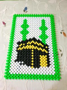 this is an image of a cross stitch bead art project that looks like legos