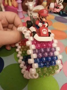 a nintendo mario kart car made out of beads