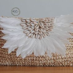 Introducing our stunning Boho Purse, handmade with love from natural raffia. This purse is the perfect accessory for your summer outfits, giving them a delightful tropical flair. Its intricate weaving and earthy tones effortlessly blend with any ensemble, making it a versatile must-have for your bohemian-inspired wardrobe. check it out for more details on Our Etsy Shop, link on bio. #artiliving #artilinestyle #artiinteriorproducts #bohochic #raffiapurse #summerstyle #tropicalvibes Handmade White Pouch Clutch, Handmade White Clutch As Gift, White Handmade Clutch For Gift, Handmade White Clutch For Gift, Bohemian Woven Clutch In Natural Color, Handwoven Bohemian Clutch In Natural Color, Bohemian Summer Clutch Rectangular, Bohemian Summer Clutch As Gift, Bohemian Rectangular Clutch For Summer