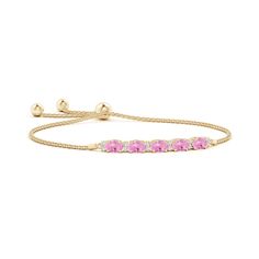 Oval pink sapphires are held in an east-west setting and accompanied with glittering diamonds in between them. This chic and elegant bolo bracelet, crafted in 14k yellow gold, is adjustable to fit most wrists. Bracelet With Diamonds, Bolo Bracelet, September Birthstone Jewelry, Tourmaline Bracelet, Chic And Elegant, Diamond Glitter, Sapphire Bracelet, Pink Bracelet, East West