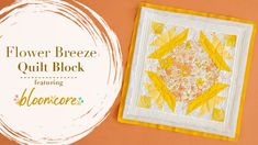 the flower breeze quilt block is next to an orange background