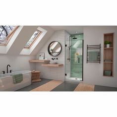 an attic bathroom with skylights and a large bathtub