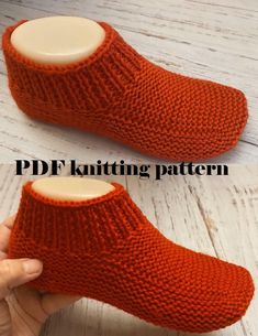 someone is holding their feet up to knitted slippers with the words pdf knitting pattern