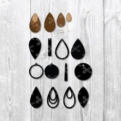 a group of different shapes and sizes of earrings on a white wooden background with text overlay