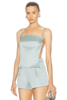 Self: 100% polyester, Lining: 95% polyester 5% elastane.  Made in China.  Hand wash.  Adjustable shoulder and back straps.  Satin fabric.  .  .  .  .  .  .  .  .  .  .  . Posh Clothing, Chelsea Blue, Moving Eyes, Cult Gaia, Beach Tops, Blue Hydrangea, Cami Tanks, Satin Fabric, Baby Blue