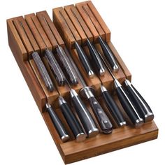 an assortment of kitchen utensils in a wooden holder