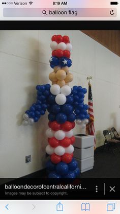 balloons are arranged in the shape of an american flag balloon column, along with stars and stripes