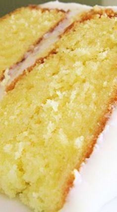 a close up of a slice of cake on a plate with frosting and icing