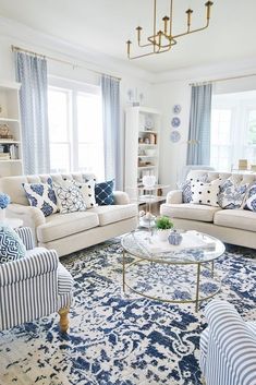 a living room with blue and white furniture