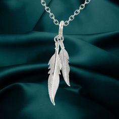 Design: Sterling Silver Feather Necklace with Two Feather Pendants Chain Length: 18 Inches This elegant sterling silver feather necklace features two delicately detailed feather pendants. The design captures the beauty and grace of feathers in a stylish and versatile piece of jewelry. The 18-inch chain complements the pendant, making it a charming addition to your everyday attire or a thoughtful gift for someone special. Silver Feathered Sterling Silver Necklaces, Silver Sterling Silver Necklaces With Feathers, Feather Ideas, Silver Bird Necklace, Silver Feather Necklace, Feather Pendant Necklace, Pendant Making, Silver Bird, Feather Ring