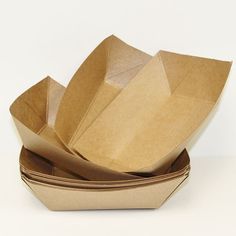 several brown paper bags stacked on top of each other