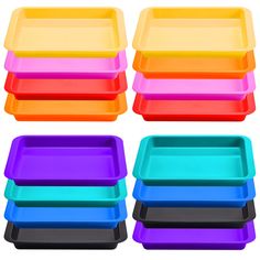 six different colored trays stacked on top of each other