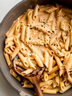 a skillet filled with pasta and sauce