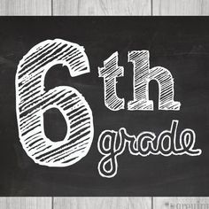 the 6th grade sign is written in chalk on a blackboard