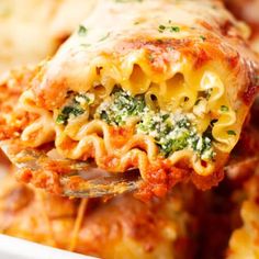 a fork full of lasagna casserole with broccoli and cheese