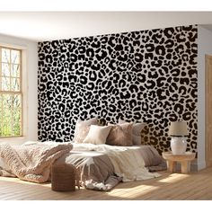 a leopard print wallpaper in a bedroom